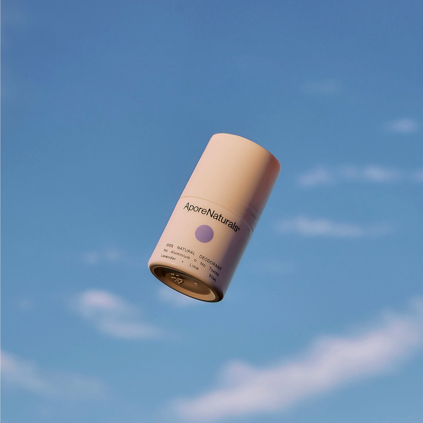 Lavender + Lime natural deodorant with sky background