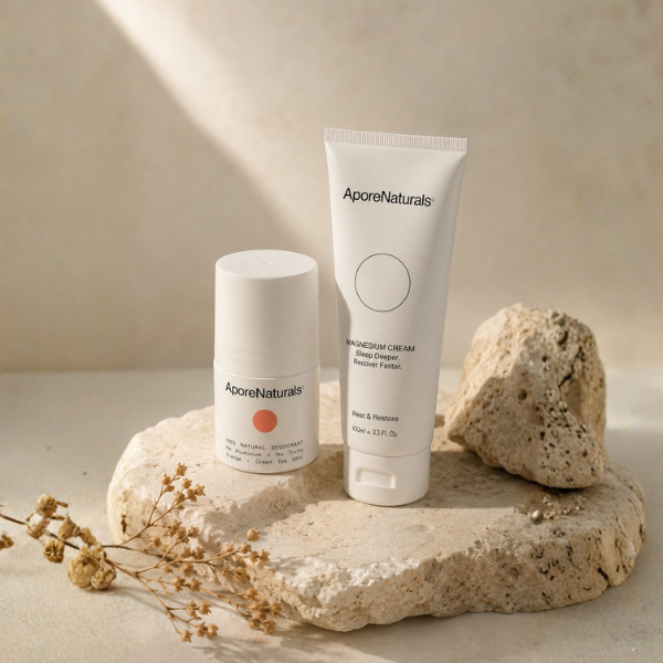 AporeNaturals deodorant and magnesium cream tube on rock platform