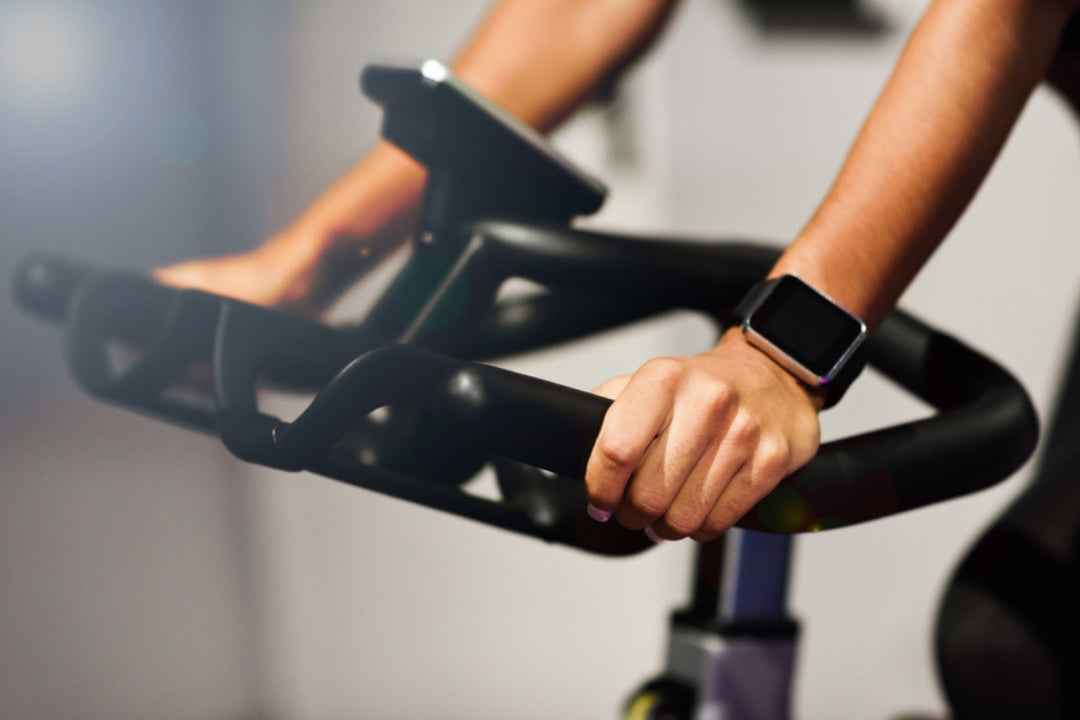 Spin bike in a studio, set up for a tough indoor cycling workout that aluminium-free natural deodorant lasts through in tropical heat.